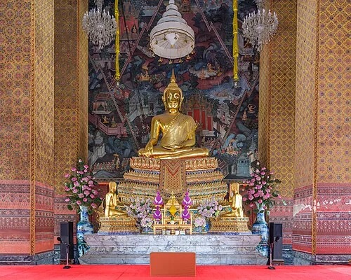 A detailed interior view of a gilded Buddha image depicted in the Palilai posture at Wat Kalayanamitr Woramahawihan in the Wat Kanlaya district of Bangkok, Thailand.
Wat?